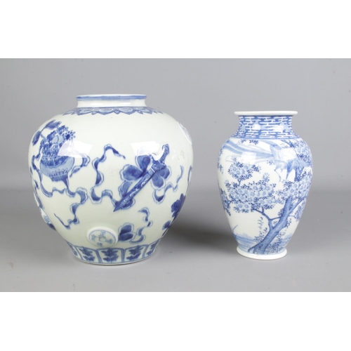 96 - A Chinese baluster vase decorated in underglaze blue with another blue and white porcelain vase with... 