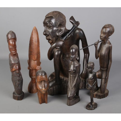 146 - A collection of tribal carved wooden figures.