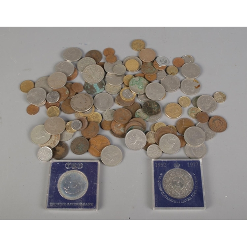 123 - A tin of mostly pre decimal coinage including commemorative crowns