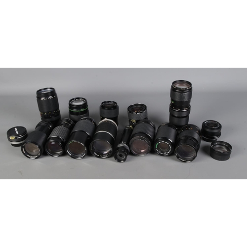 204 - A box of assorted camera lenses to include Mitakon, Sirius, Miranda, Soligor, Tokina, etc.