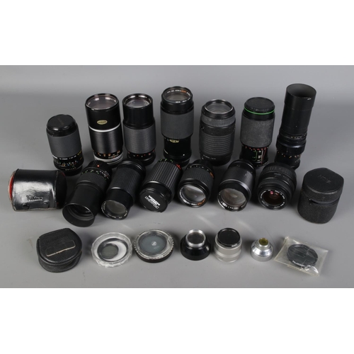 239 - Group of camera lenses by various makers, together with converters and other accessories, including ... 