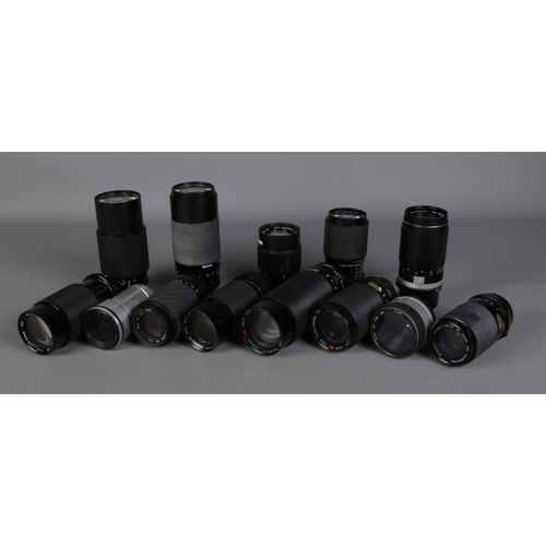 240 - A collection of assorted camera lenses to include Sigma, Makinon, Tefnon, Panagor, Miranda, etc.