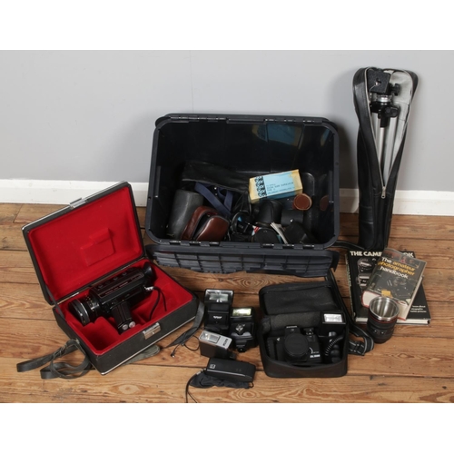 241 - Mixed collection of photography equipments, various cameras, flash lights, a tripod, camera books an... 