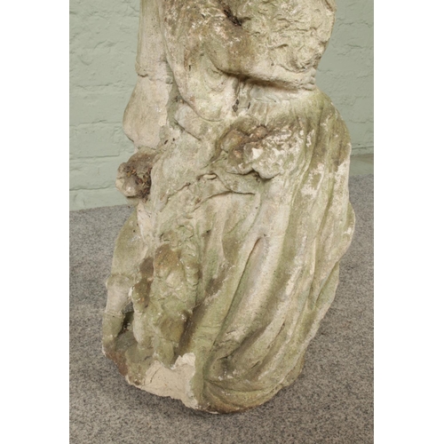 287 - A cast concrete garden statue, formed as two lovers. Height 71cm.