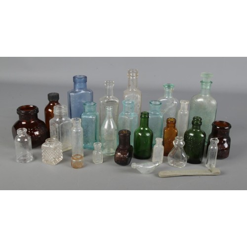 64 - A collection of vintage glass bottles. Includes Gordon's Gin, Califig Syrup Co, Woodward Chemist, Bo... 