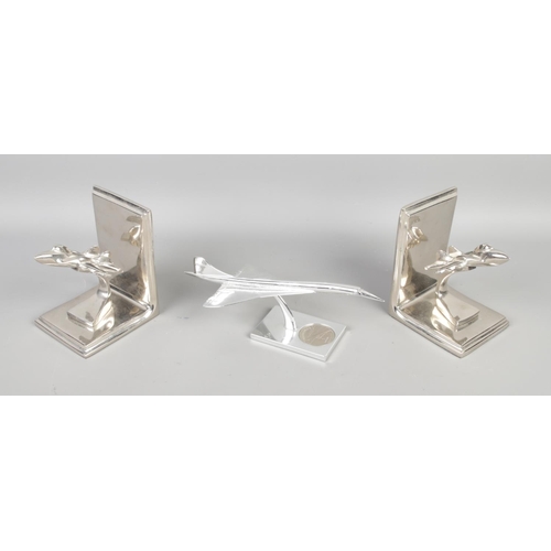 100 - A Royal Mint Concorde model with a pair of aviation bookends, Concorde model has a 5 Dollars coin in... 