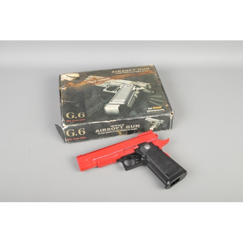 101 - A Galaxy G6 Full Metal Pistol 6mm BB Gun in red, length 22cm, boxed.