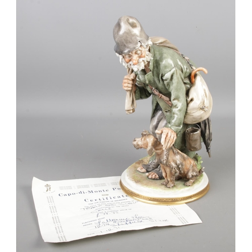 143 - A Capodimonte figure by Gelle, titled Tramp and Scamp. Height 27cm.