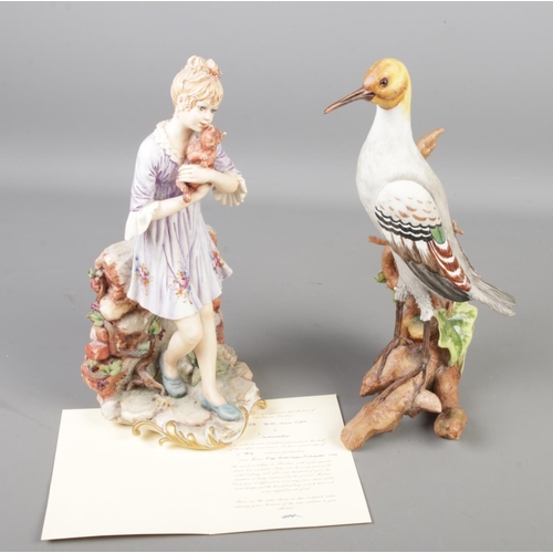 146 - Two Capodimonte figures. One modelled as a girl with a cat by Sandro, the other a bird. Both approxi... 