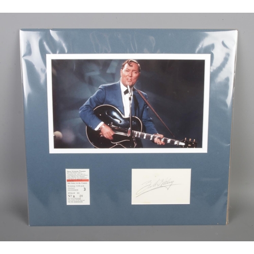 153 - Bill Haley autographed with a New Victoria Theatre ticket display, size 38x37cm.