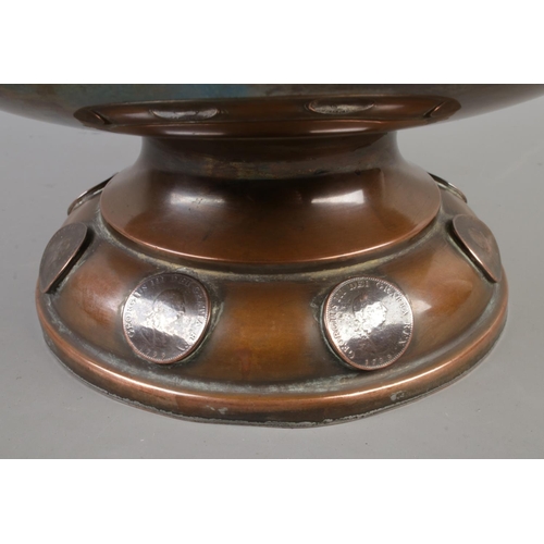 17 - A 19th century copper pedestal bowl decorated with inset 1799 copper farthing coins. Height 18cm, Di... 