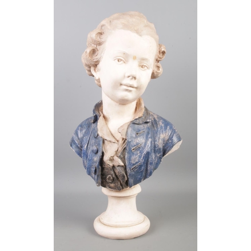 26 - A plaster bust of a young boy.

Hx33cm