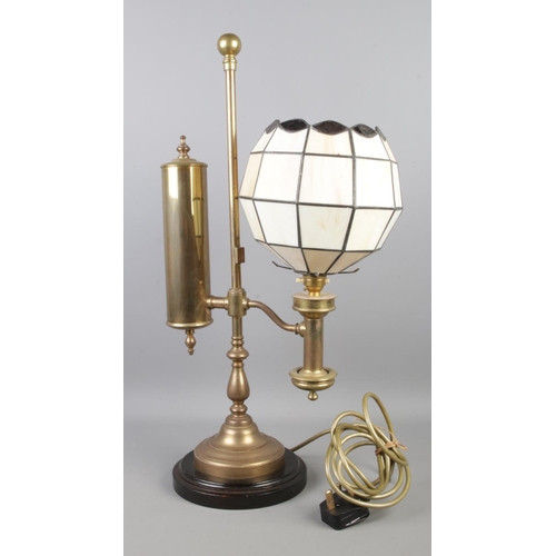 27 - An early 20th century brass on wooden base gas table lamp converted to electricity.