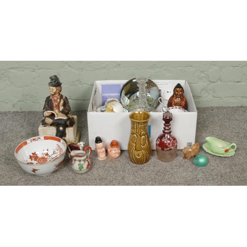 200 - A box of assorted miscellaneous, to include Laurel and Hardy salt and pepper shakers, glass paperwei... 