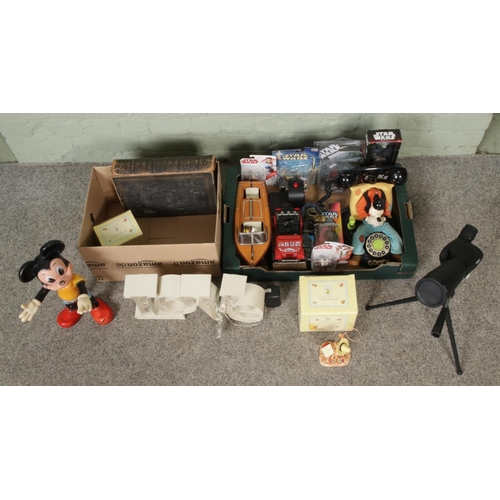 218 - Two boxes of miscellaneous, to include Warner Bros Goofy phone, Royal Doulton Winnie-the-Pooh figuri... 