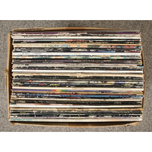 230 - A box containing a selection of heavy metal and rock records, including 7