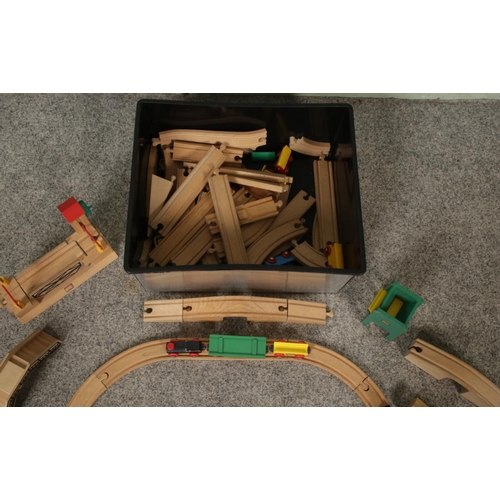 231 - A box of Brio wooden model railway. Incudes track, trains and buildings.