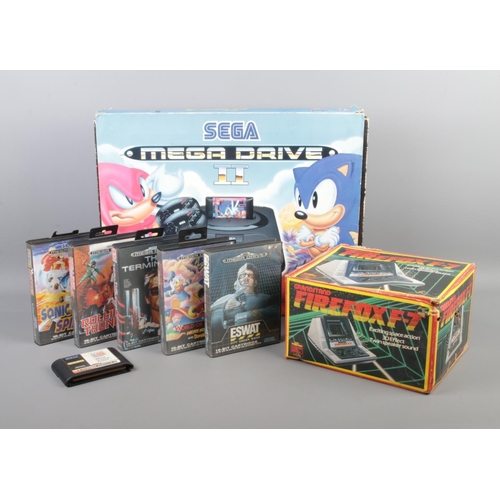 253 - A Sega Mega Drive II console, in Sonic 3 sleeve, together with a collection of gaming cartridges and... 