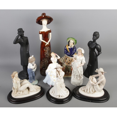 41 - A group of figurine ornaments, including two Royal Wessex black basalt style figures, Lladro NAO 106... 