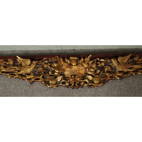 277 - A large late 19th/early 20th century gilt carved wood archway/frieze depicting basket of pomegranate... 