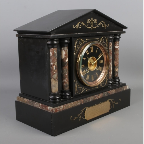 48 - A slate and marble mantle clock, featuring Corinthian style columns and bearing presentation plaque ... 