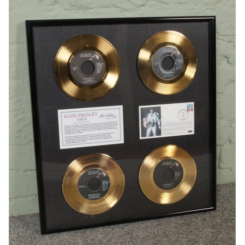 332 - A framed Elvis Presley limited edition gold coloured vinyl singles display titled 'Elvis Presley 196... 