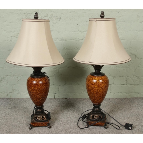 60 - A pair of contemporary urn shape faux marble table lamps. Height 82cm.