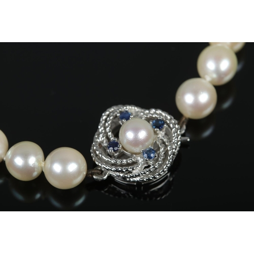 382 - A pearl bracelet, with 9ct White Gold clasp set with four sapphire stones surrounding a pearl.