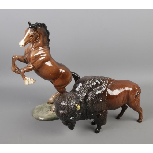 401 - Two Beswick ceramic figures to include Bison model 1019 and rearing Welsh Cob horse model 1014.