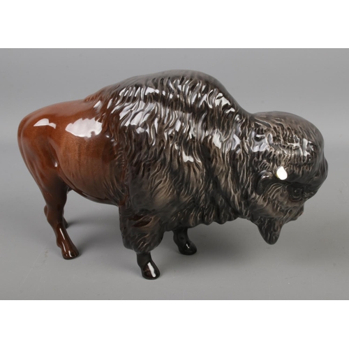 401 - Two Beswick ceramic figures to include Bison model 1019 and rearing Welsh Cob horse model 1014.