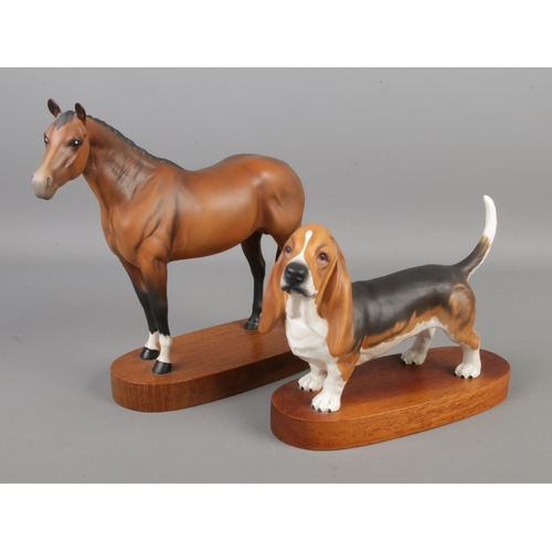 405 - Two Beswick figures on wooden stands, Thoroughbred horse and Bassett Hound.