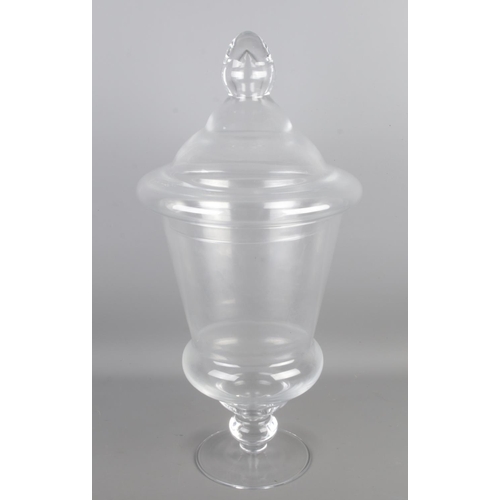 77 - A large vintage blown glass apothecary jar with lid, height 60cm width 28cm.