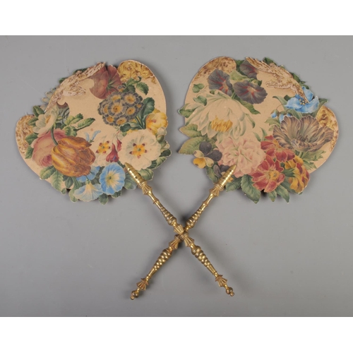 78 - A pair of Victorian card face screen fans featuring floral design with decoupage lions and eagle wit... 