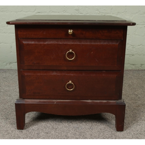 409 - A small Stag two drawer bedside cabinet. Approx. dimensions 53cm x 47cm x 51cm.