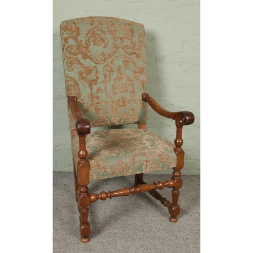 420 - An antique throne chair with upholstered seat and backrest