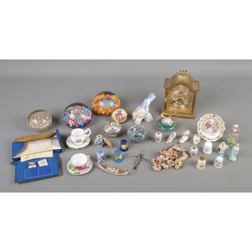 87 - A small quantity of collectable glass and ceramics to include millefiori paperweight, miniature Limo... 