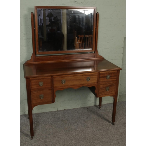 438 - An Edwardian inlaid dressing table with mirror on original brass castors.

Hx152cm
Wx114cm
Dx50cm