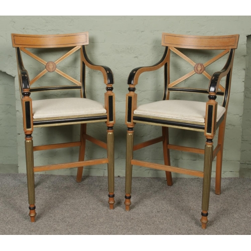 440 - A pair of Clive Christian style beech and ebonised high armchairs, with gilt highlights, X-form back... 