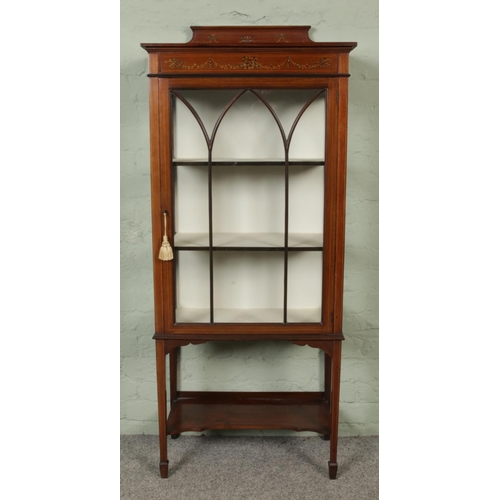 445 - An Edwardian mahogany display cabinet with glazed front and three inner shelves, raised on tapering ... 