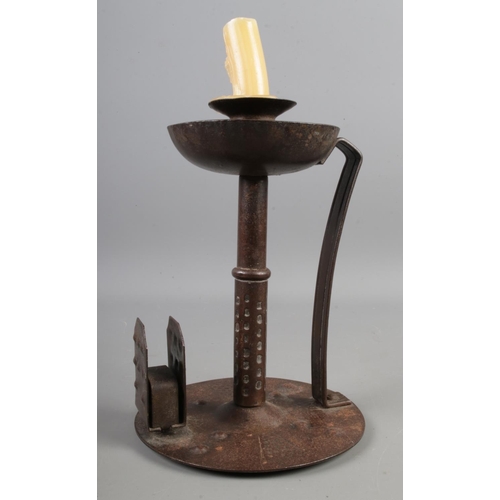 9 - An Arts & Crafts iron chamberstick designed by Hugo Berger manufactured by Goberg, Germany c.1908-19... 