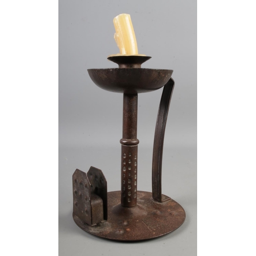 9 - An Arts & Crafts iron chamberstick designed by Hugo Berger manufactured by Goberg, Germany c.1908-19... 