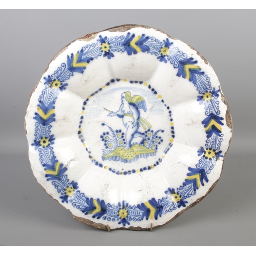 A C1760 Dutch Delft charger with lobed design depicting central design of a cherub in field.

Diameter 35cm