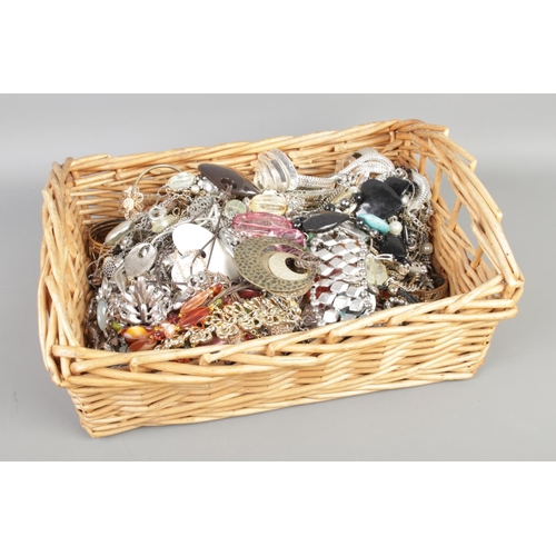 99 - A full basket of mixed costume jewellery, including necklaces, bangles, rings, patents etc.