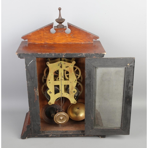 98 - A vintage Fattorini & Sons Bradford alarm mantel clock, with its original pendulum and key, height 4... 