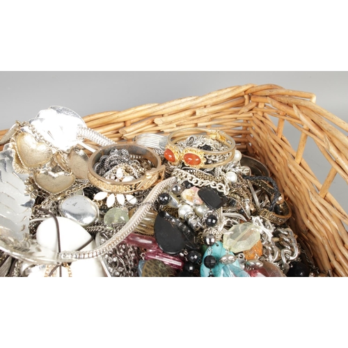 99 - A full basket of mixed costume jewellery, including necklaces, bangles, rings, patents etc.