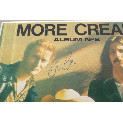 168 - A mounted album cover; More Cream, Album No.2, bearing signature for Eric Clapton, signed in pen. He... 