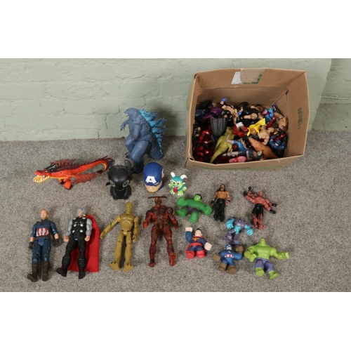 252 - A box of assorted children's action figures to include Superman, Scarlet Witch, WWE, Groot, Mr. Incr... 