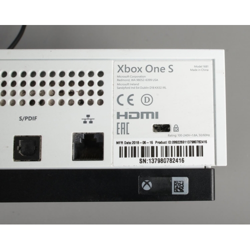 283 - An XBox One S, in white (Model 1681) with power lead and blue Power A controller.