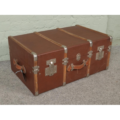 299 - A large vintage wooden bound travel steamer trunk. Height 36cm, Width 79cm, Depth 50cm.