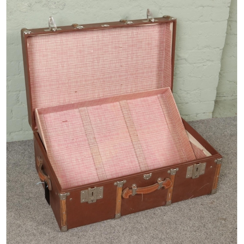 299 - A large vintage wooden bound travel steamer trunk. Height 36cm, Width 79cm, Depth 50cm.